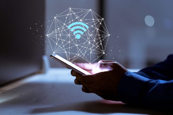 Business using smartphone,with wifi icon,business communication social network concept.